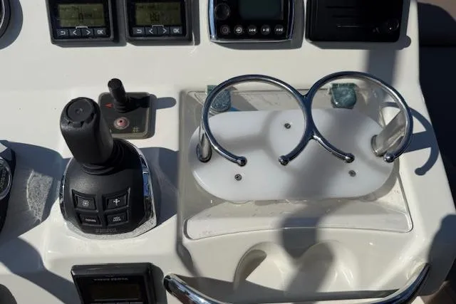 Slide: The Image of Luxury seating on 2015 Prestige 500 yacht with striped cushion, docked by waterfront homes. - 71