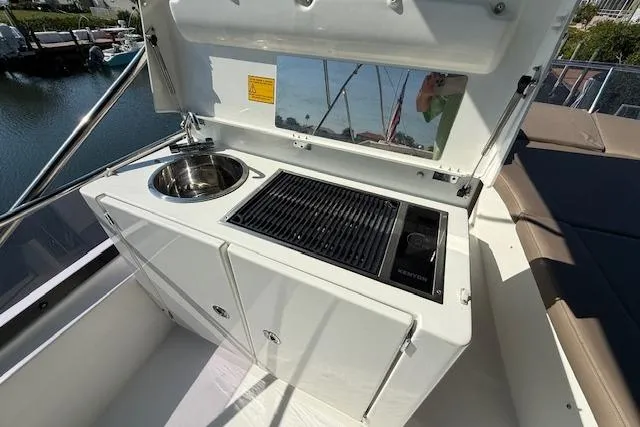 Slide: The Image of Cockpit of a 2015 Prestige 500 yacht with advanced navigation and control systems. - 73