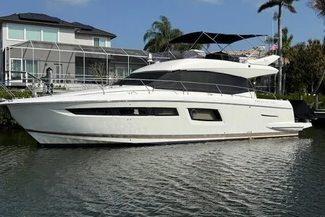 Slide: The Image of Luxury 2015 Prestige 500 yacht docked in urban marina setting. - 9