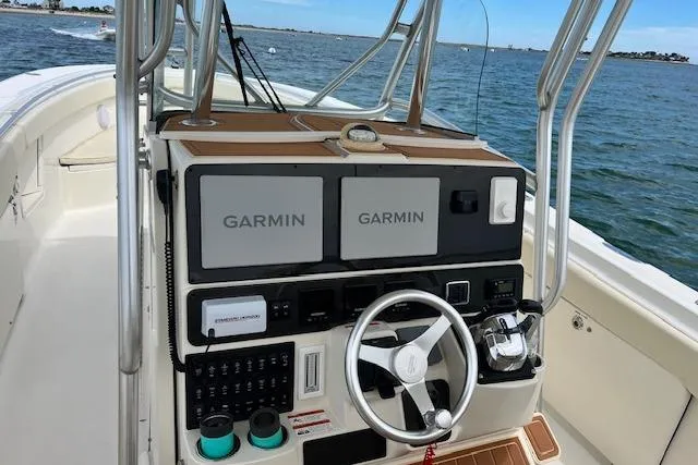 Slide: The Image of 2005 Hydra-Sports Vector 3300 CC boat dashboard with Garmin navigation systems. - 11