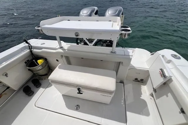 Slide: The Image of 2005 Hydra-Sports Vector 3300 CC boat deck with seating and storage, on calm water. - 13