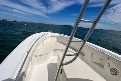 Slide: The Image of 2005 Hydra-Sports Vector 3300 CC boat on open water under blue sky. - 16