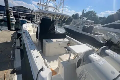 Slide: The Image of 2005 Hydra-Sports Vector 3300 CC boat docked at a marina under a clear sky. - 18