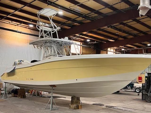 Slide: The Image of 2005 Hydra-Sports Vector 3300 CC boat in a warehouse, elevated on blocks. - 6