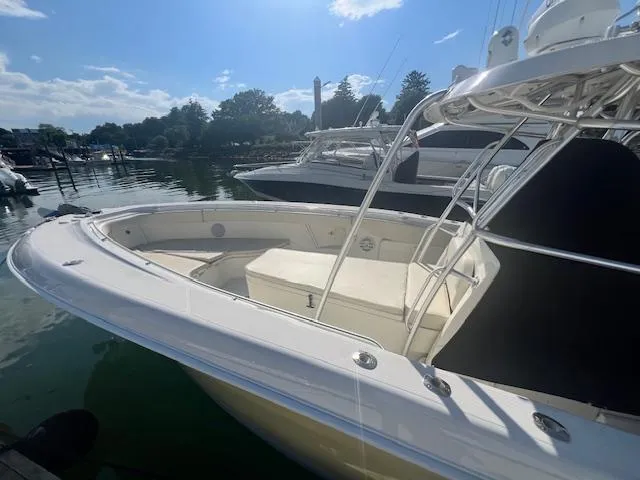 Slide: The Image of 2005 Hydra-Sports Vector 3300 CC boat docked in a serene marina setting. - 8