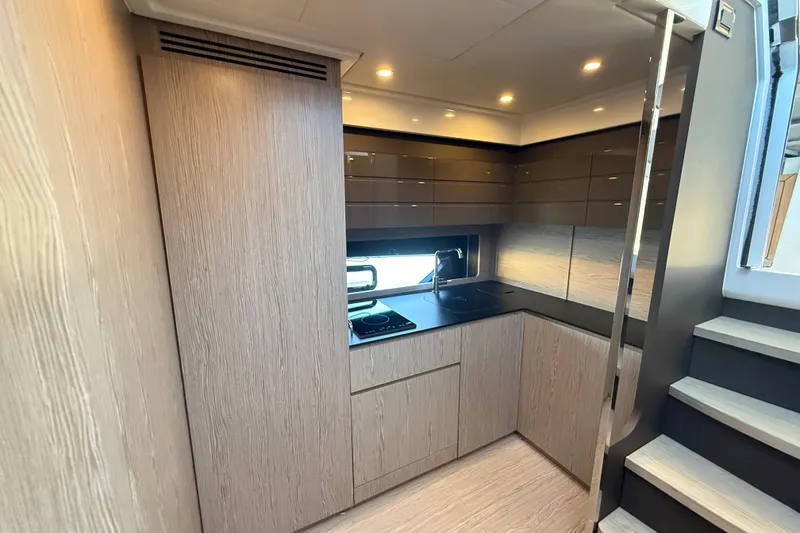 Slide: The Image of Modern kitchen interior of 2018 Azimut Atlantis 43 yacht with sleek cabinetry and appliances. - 13