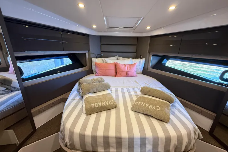 Slide: The Image of Luxurious bedroom interior of 2018 Azimut Atlantis 43 yacht with striped bedding and modern design. - 17