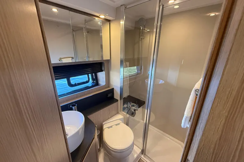 Slide: The Image of Luxurious bathroom in 2018 Azimut Atlantis 43 yacht with modern fixtures and shower. - 18