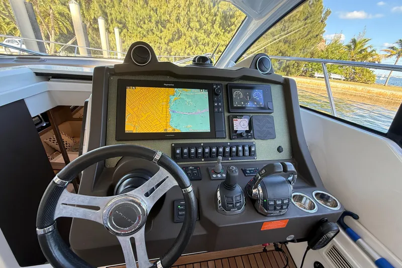 Slide: The Image of Cockpit of 2018 Azimut Atlantis 43 yacht with navigation controls and display. - 4