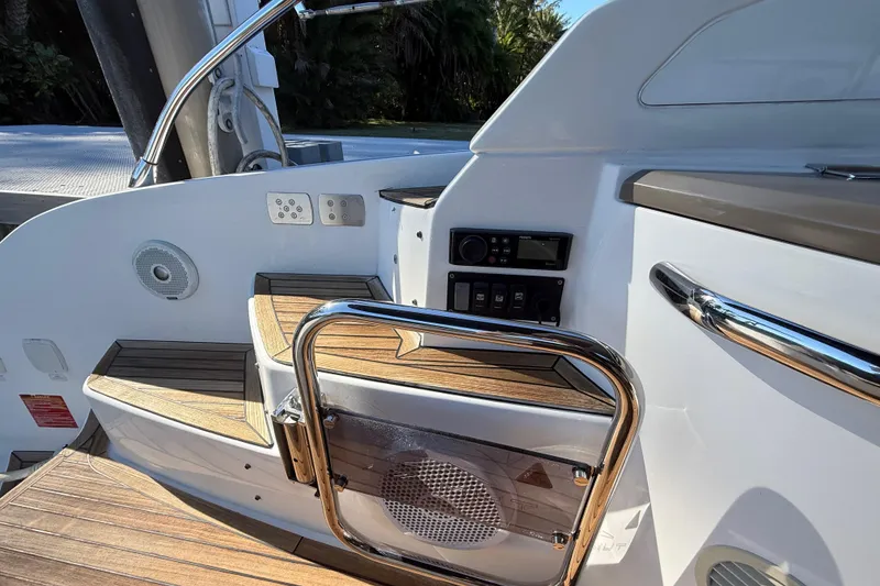 Slide: The Image of 2018 Azimut Atlantis 43 yacht interior with wooden steps and control panel. - 6