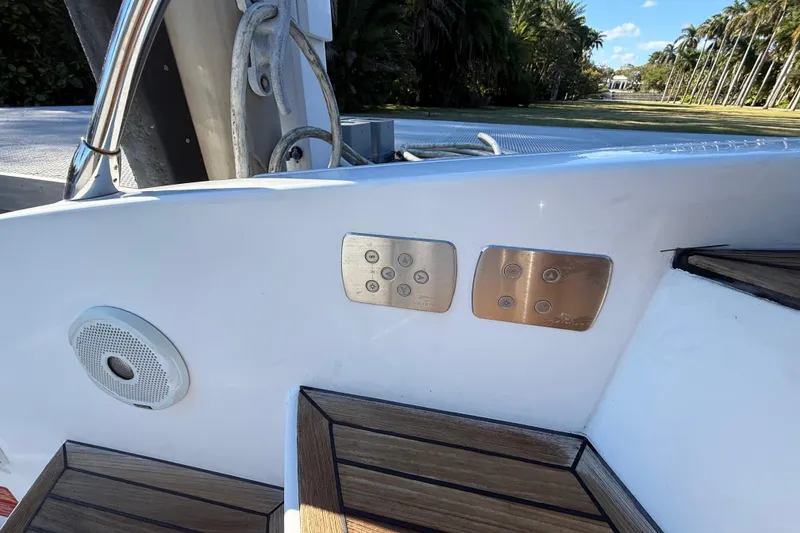 Slide: The Image of Azimut Atlantis 43 yacht controls and speaker, 2018 model, with wooden steps and scenic background. - 7