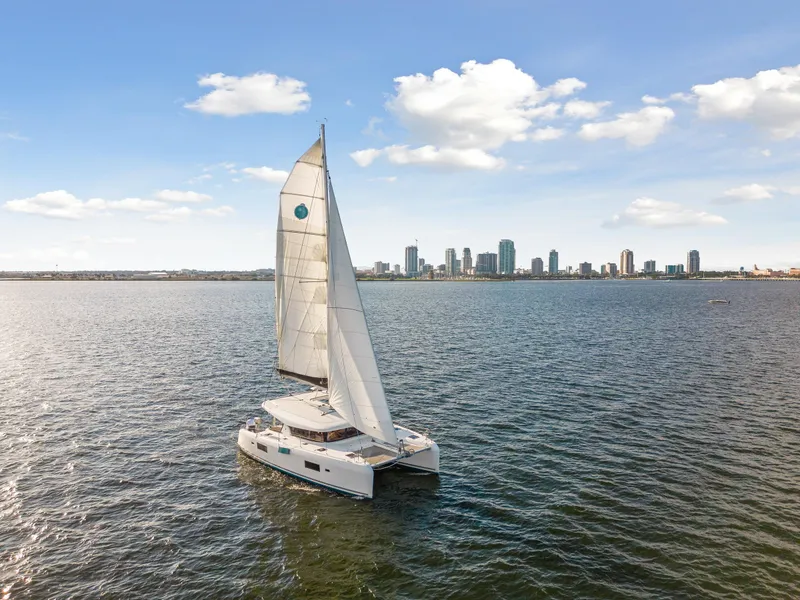Slide: The Image of Lagoon 42 catamaran sailing near city skyline, 2018 model. - 3