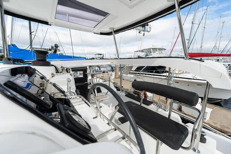 Slide: The Image of Cockpit view of 2018 Lagoon 42 catamaran at marina. - 32