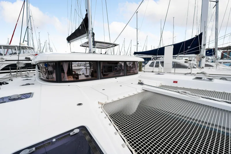 Slide: The Image of 2018 Lagoon 42 catamaran with spacious deck and netting. - 41
