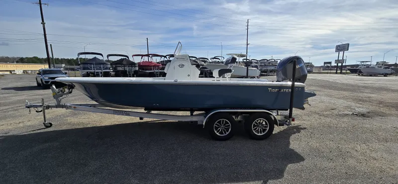 Slide: The Image of Tidewater 2110BMT 2026 boat parked on trailer outdoors. - 3