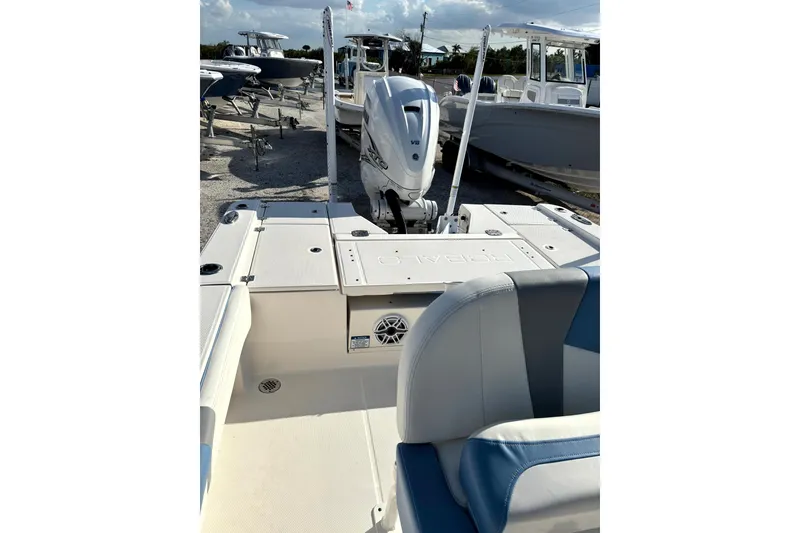 Slide: The Image of 2023 Robalo 266 Cayman boat interior with seating and outboard motor. - 19