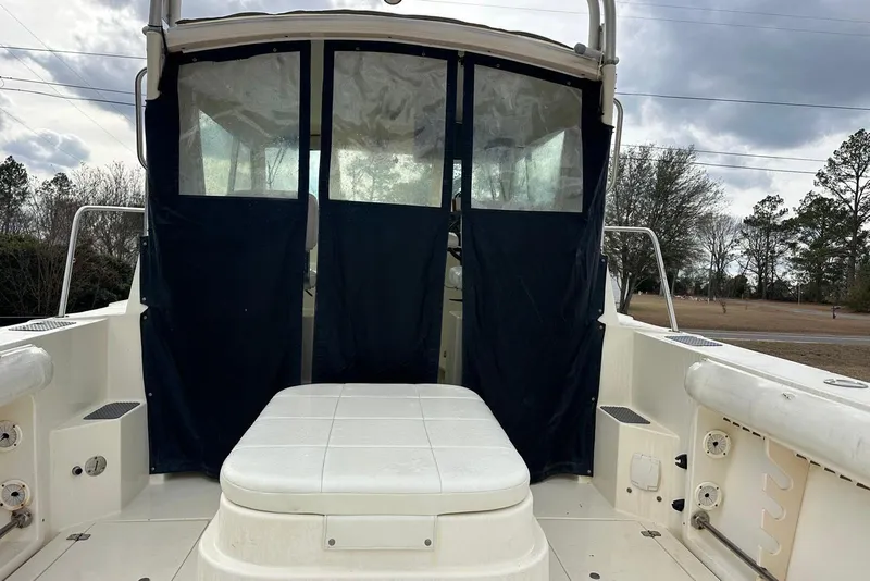 Slide: The Image of 2000 Albin 28 Tournament Express boat interior with seating and covered windows. - 10