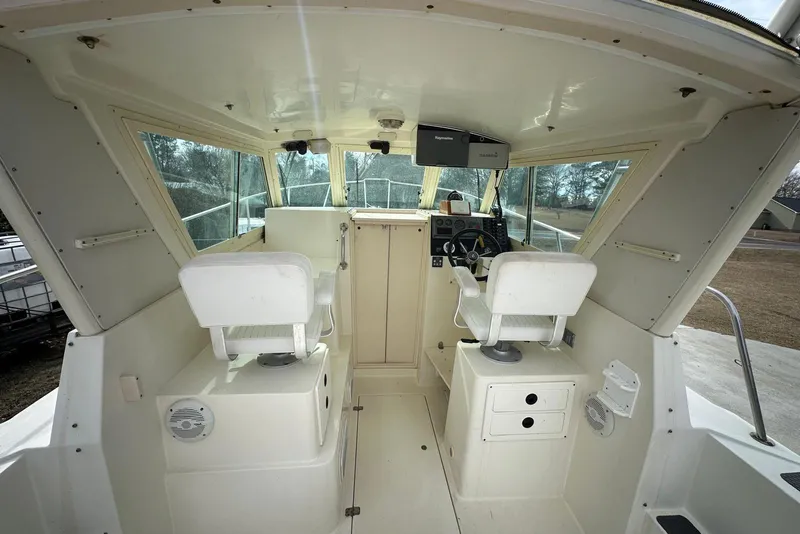 Slide: The Image of Interior of 2000 Albin 28 Tournament Express boat with helm and seating. - 11