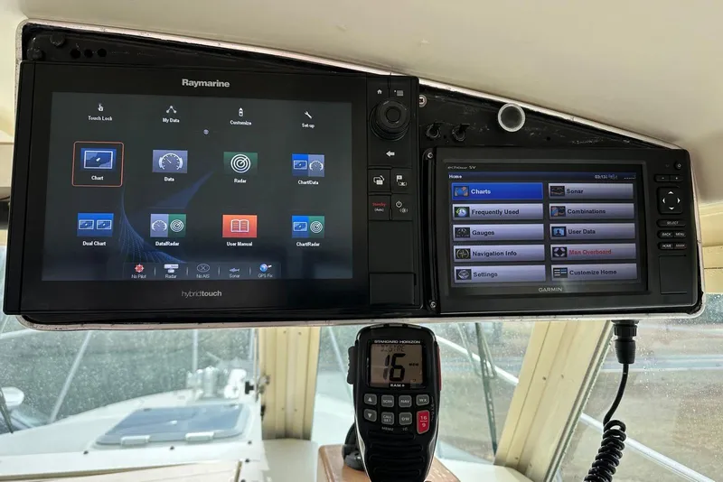 Slide: The Image of Navigation system on 2000 Albin 28 Tournament Express with Raymarine and Garmin displays. - 13