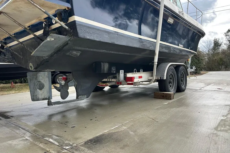 Slide: The Image of 2000 Albin 28 Tournament Express boat on trailer, showcasing hull and propeller. - 28