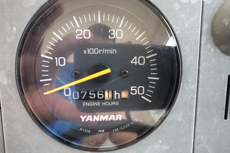 Slide: The Image of Yanmar engine tachometer showing 7561 hours on Albin 28 Tournament Express, year 2000. - 31