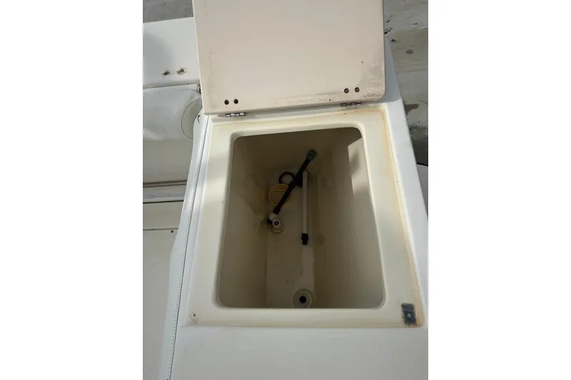 Slide: The Image of Open storage compartment on a 2000 Albin 28 Tournament Express boat. - 34