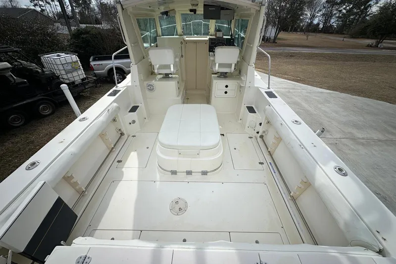 Slide: The Image of 2000 Albin 28 Tournament Express boat interior with seating and helm station. - 9