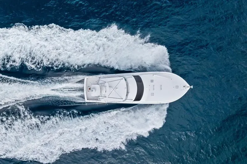 Slide: The Image of Aerial view of 2005 Viking 61 Convertible yacht cruising on open ocean. - 11