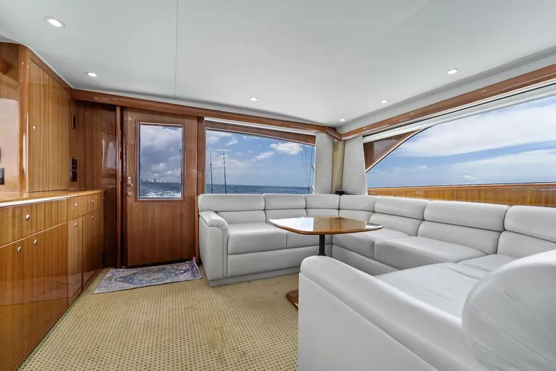Slide: The Image of Luxurious interior of 2005 Viking 61 Convertible yacht with plush seating and ocean view. - 13