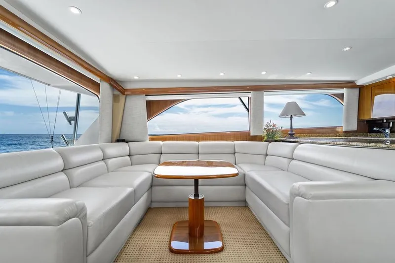 Slide: The Image of Luxurious interior of 2005 Viking 61 Convertible yacht with white leather seating and ocean view. - 15