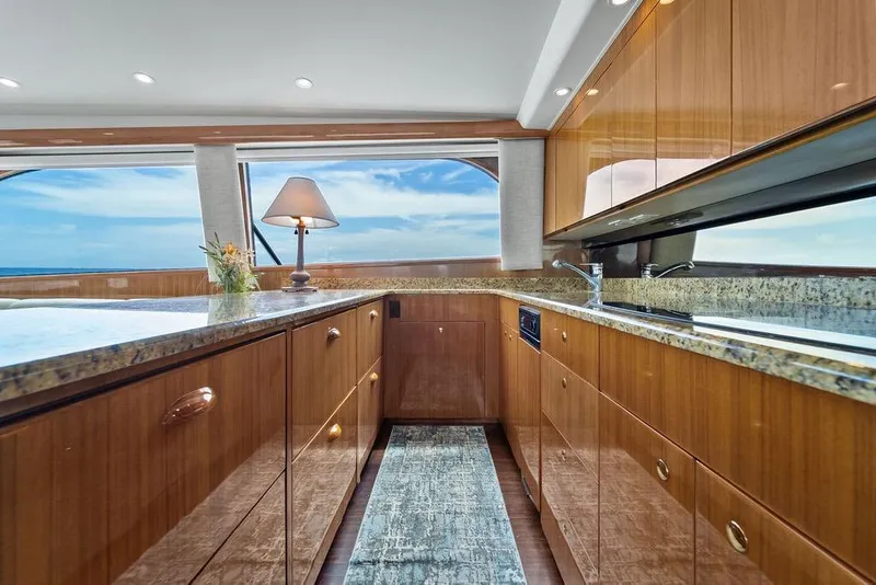 Slide: The Image of Luxurious kitchen interior of 2005 Viking 61 Convertible yacht with ocean view. - 19