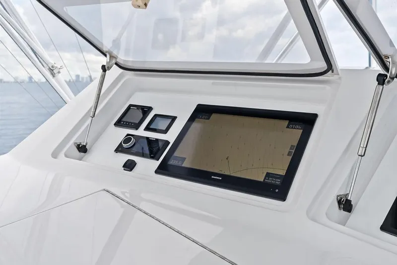 Slide: The Image of Control panel of a 2005 Viking 61 Convertible yacht with navigation display. - 25