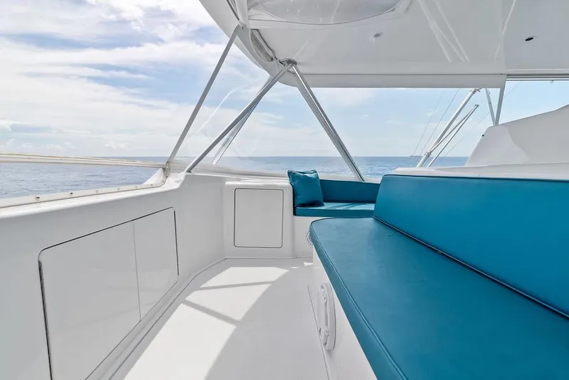 Slide: The Image of 2005 Viking 61 Convertible yacht interior with blue seating and ocean view. - 28