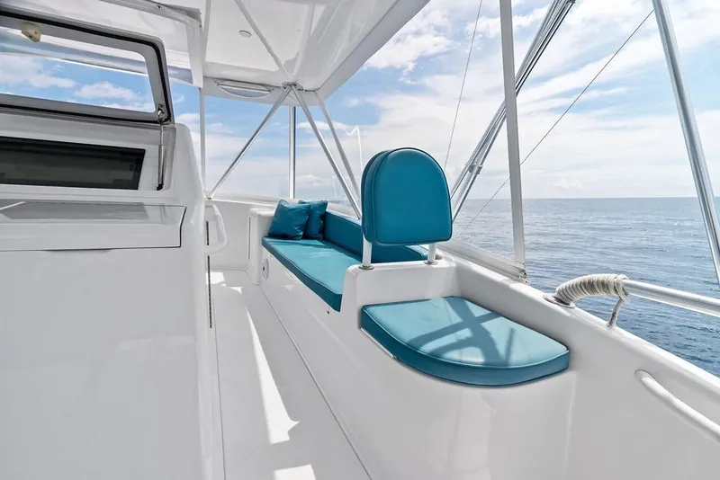 Slide: The Image of Luxurious seating on 2005 Viking 61 Convertible yacht with ocean view. - 29