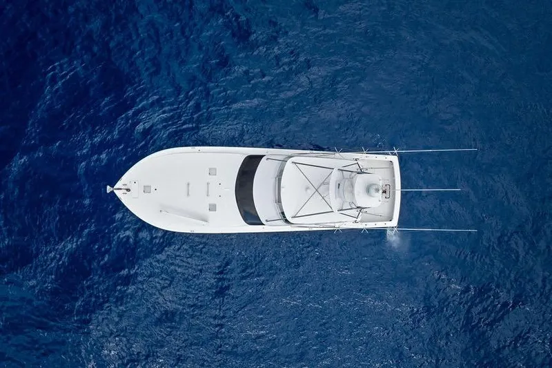 Slide: The Image of Aerial view of 2005 Viking 61 Convertible yacht on deep blue ocean. - 55