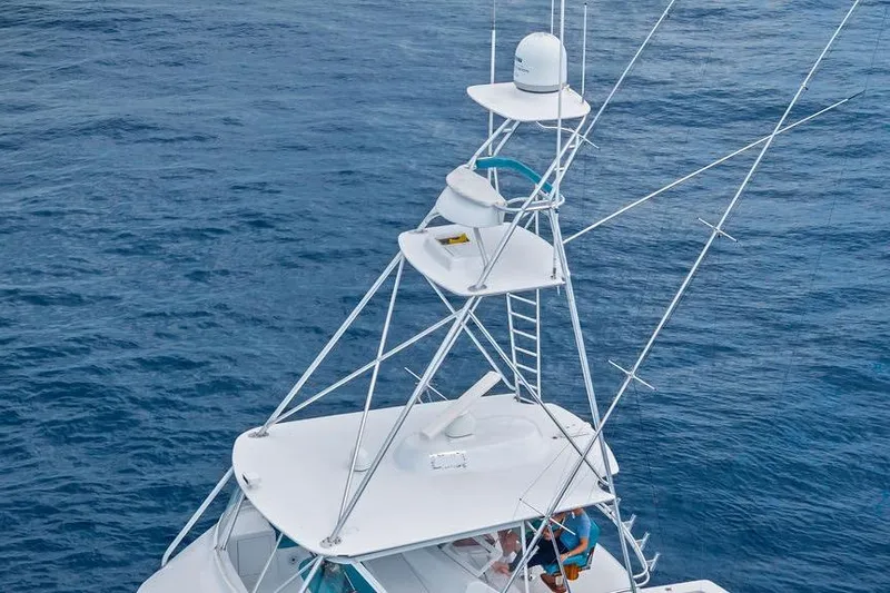 Slide: The Image of Aerial view of 2005 Viking 61 Convertible yacht tower on open ocean. - 56
