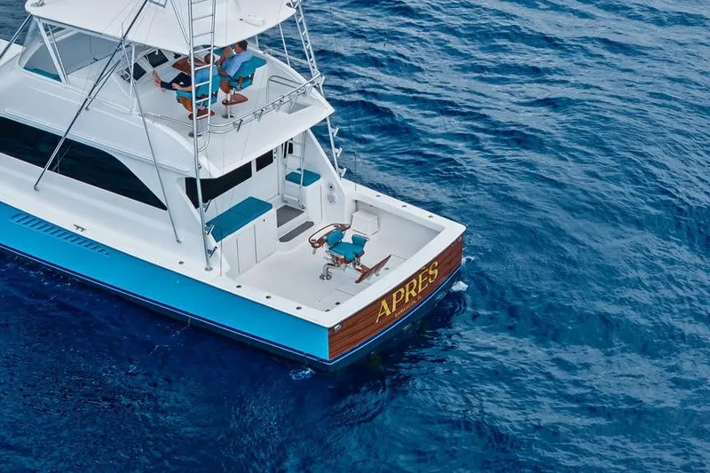 Slide: The Image of Aerial view of 2005 Viking 61 Convertible yacht on blue ocean waters. - 57