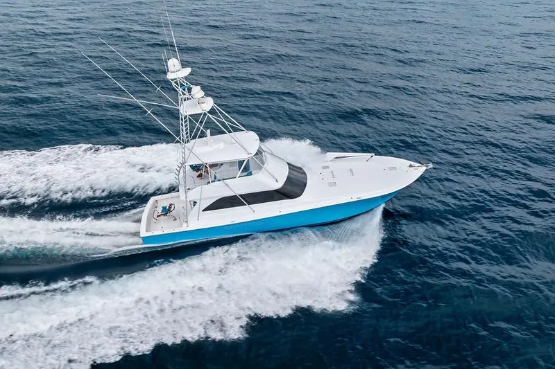 Slide: The Image of 2005 Viking 61 Convertible yacht cruising on open ocean waters. - 6