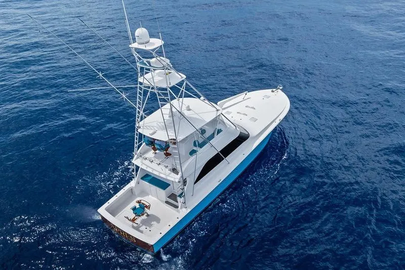 Slide: The Image of Aerial view of 2005 Viking 61 Convertible yacht cruising on open ocean waters. - 60