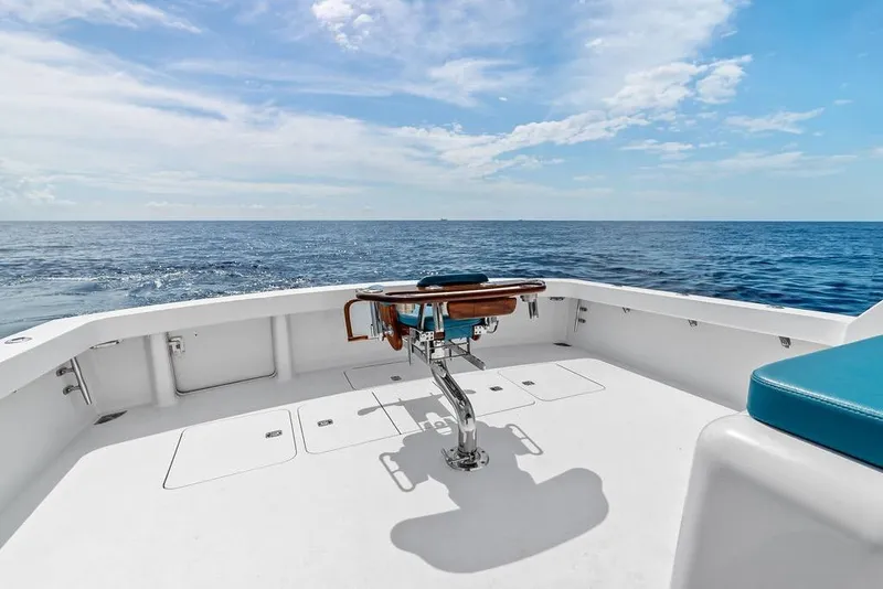 Slide: The Image of 2005 Viking 61 Convertible yacht deck with ocean view under blue sky. - 61