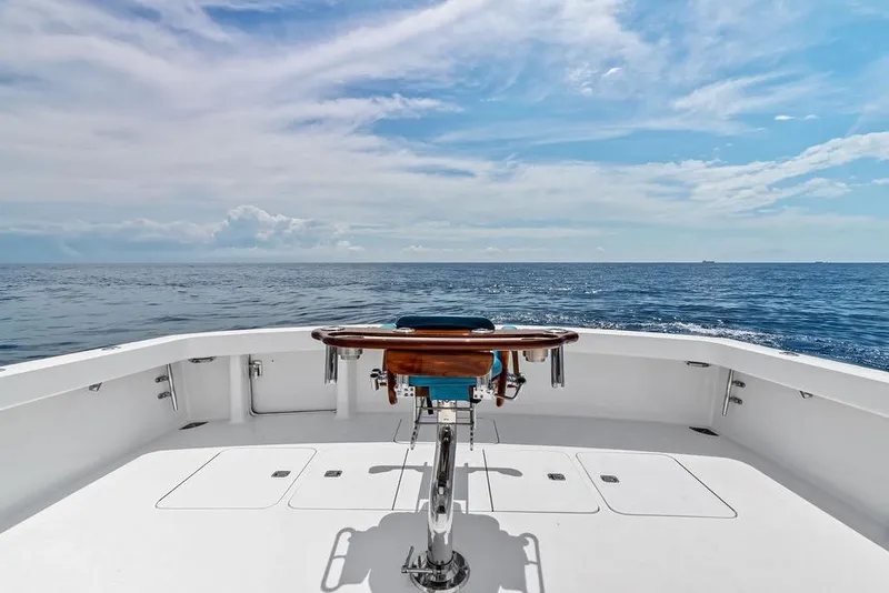 Slide: The Image of 2005 Viking 61 Convertible yacht deck with ocean view under blue sky. - 62