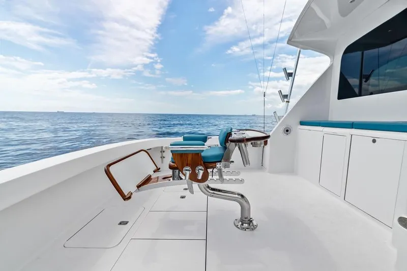 Slide: The Image of 2005 Viking 61 Convertible yacht deck with ocean view and fishing chair. - 66