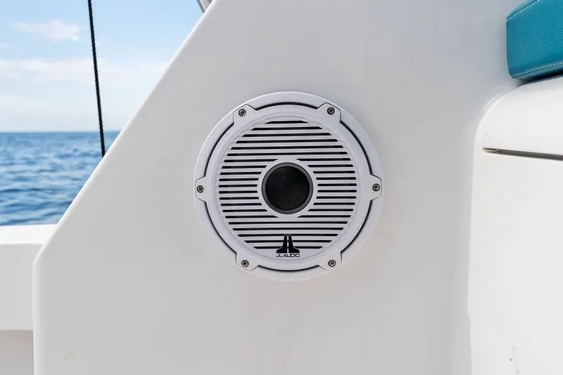 Slide: The Image of White speaker on 2005 Viking 61 Convertible yacht, ocean background. - 74