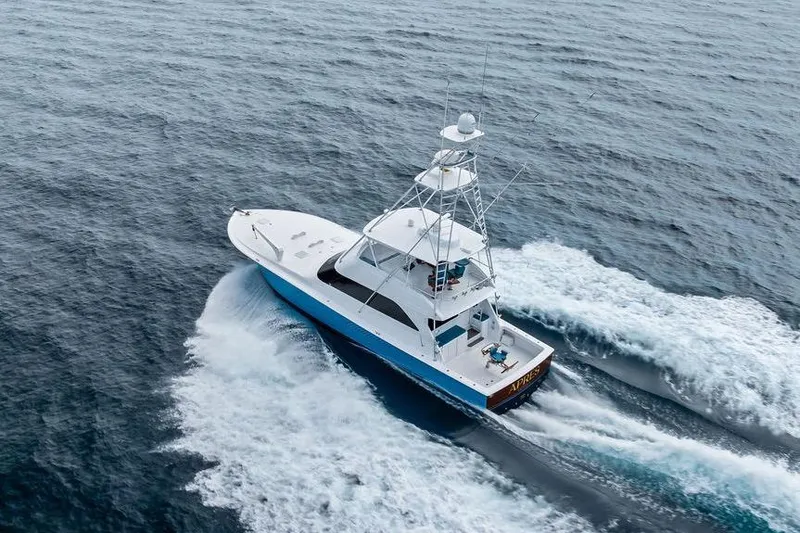 Slide: The Image of Aerial view of 2005 Viking 61 Convertible yacht cruising on open water. - 9