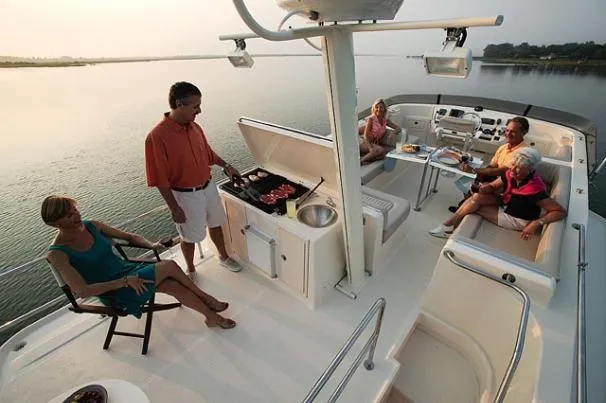 Slide: The Image of Outdoor kitchenette on 2006 Mainship 40 Trawler with sink and storage compartments. - 26