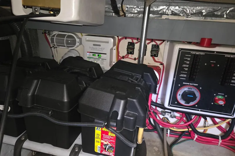 Slide: The Image of Engine room of 2006 Mainship 40 Trawler with battery boxes and control panel. - 29