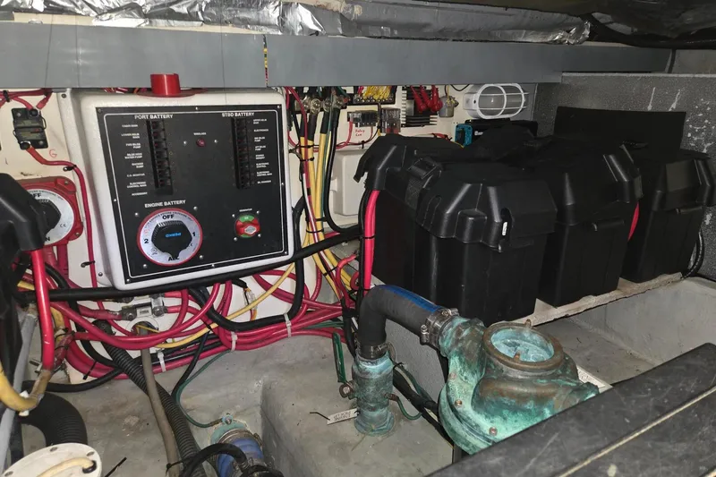 Slide: The Image of Engine room of a 2006 Mainship 40 Trawler with battery system and wiring. - 30