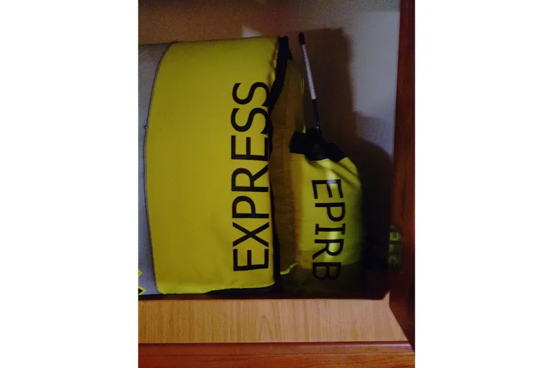 Slide: The Image of Yellow EPIRB and EXPRESS bags on a 2006 Mainship 40 Trawler. - 36