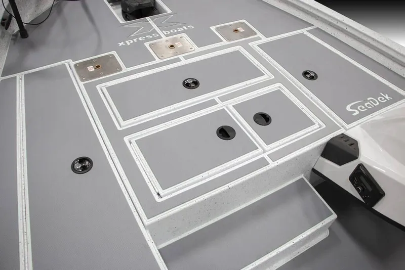 Slide: The Image of Manufacturer Provided Image: 2026 Xpress H18C Crappie boat deck with SeaDek flooring and storage compartments. - 5