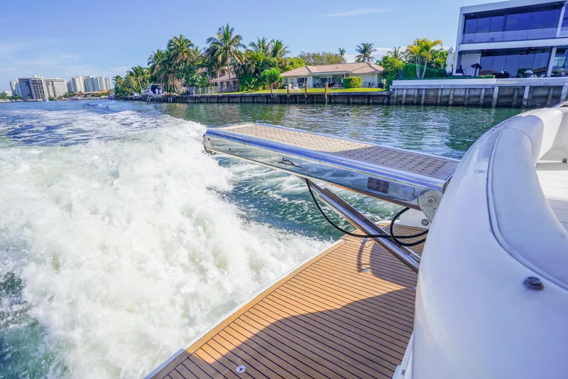 Slide: The Image of Fairline 48 Phantom yacht cruising near waterfront homes, 2009 model. - 10